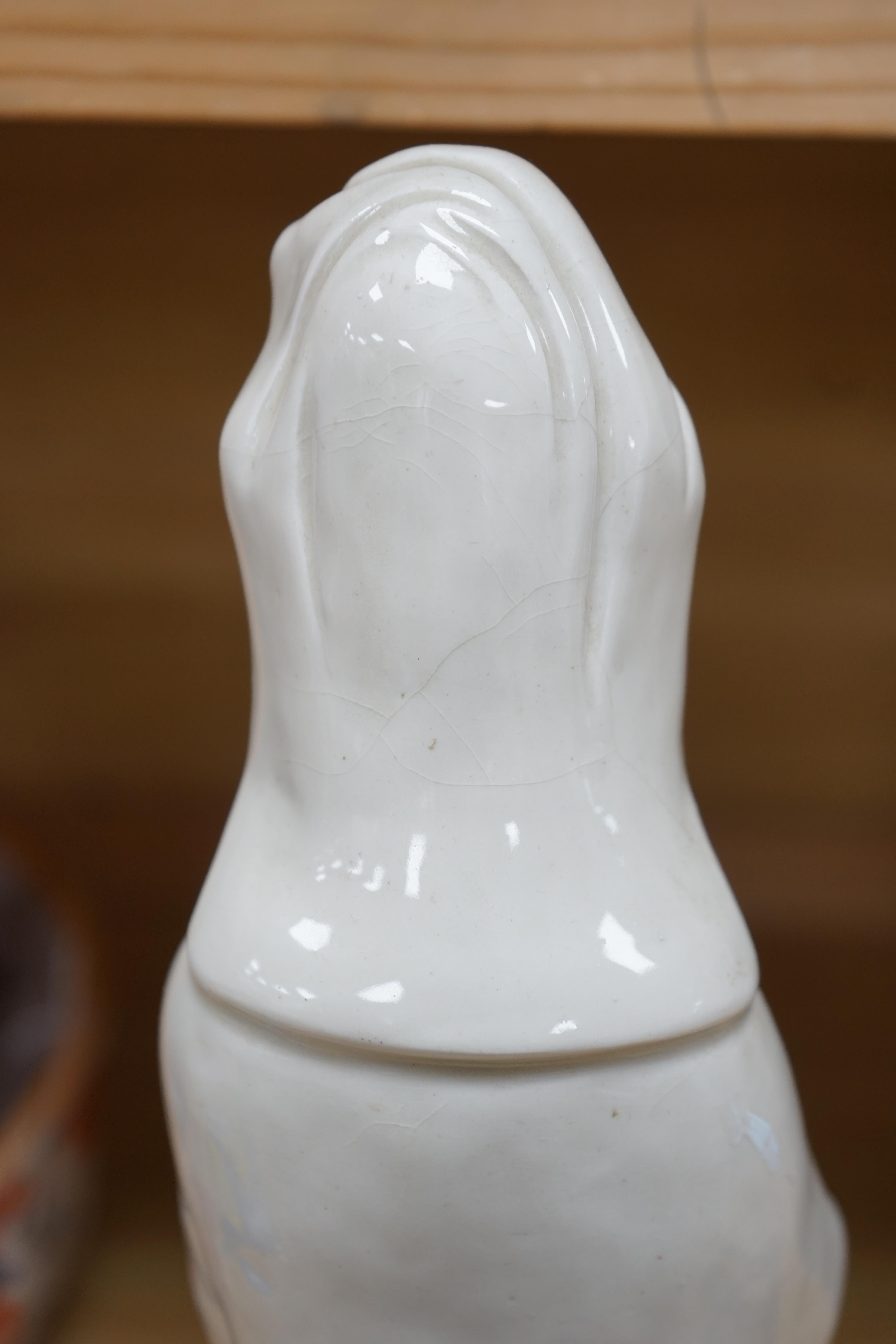 A Chinese blanc de chine figure of Guanyin, 45cm high. Condition - poor to fair, a number of fingers broken and missing